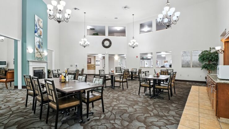 Bright, welcoming dining area with elegant chandeliers, inviting tables, and a sense of community.