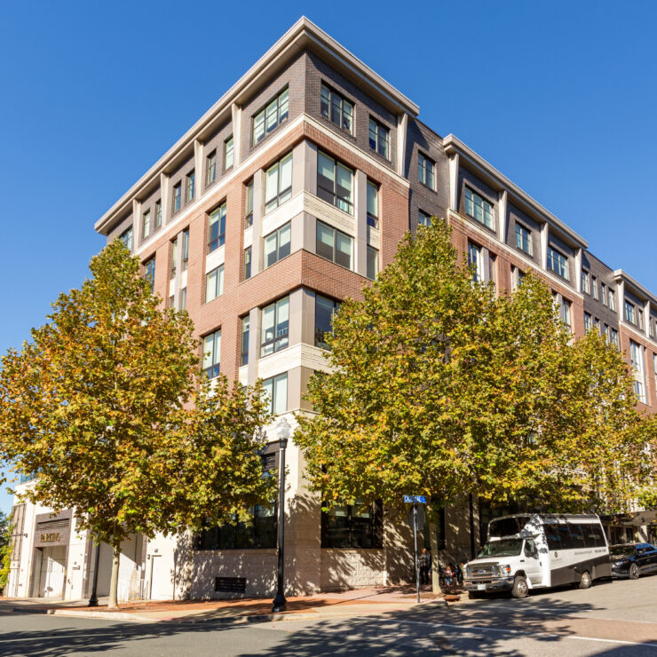 Welcoming building surrounded by vibrant trees, creating a warm community atmosphere.