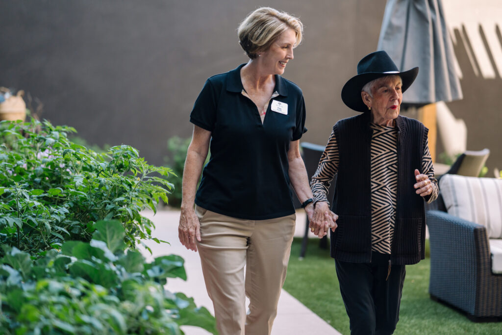 A warm moment shared in a serene garden, showcasing companionship and vibrant community spirit.