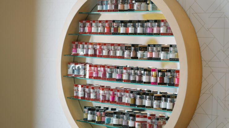 A vibrant display of nail products invites creativity and community spirit, enhancing relaxation and connection.