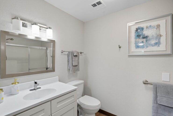Bright and inviting bathroom showcasing modern amenities, fostering comfort and community spirit.