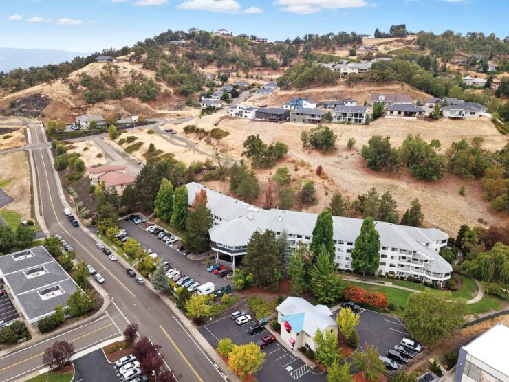 A serene community nestled among gentle hills, offering a welcoming atmosphere and beautiful surroundings.