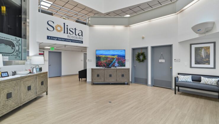 A welcoming lobby features comfortable seating and vibrant decor, fostering a sense of community and warmth.