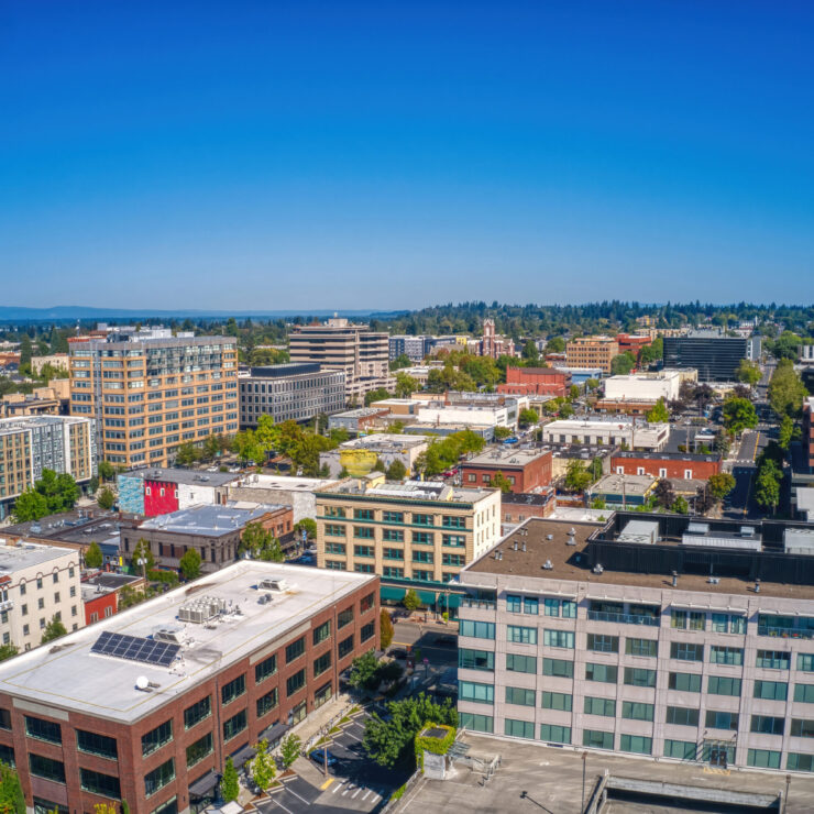 A vibrant community setting filled with greenery and welcoming buildings, perfect for comfortable living.