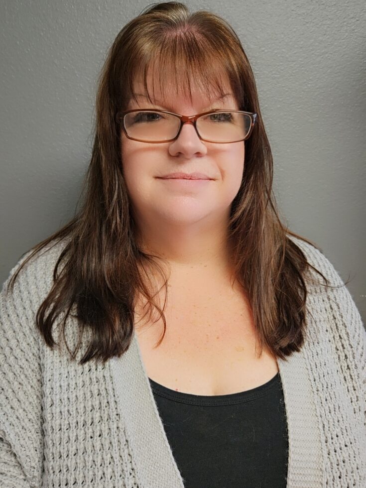 A warm and inviting atmosphere, showcasing a friendly staff member dedicated to community care.