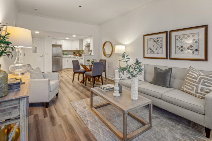 Bright and inviting living space features comfortable seating and a warm dining area for community gatherings.
