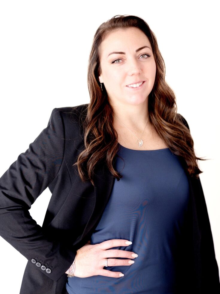 A welcoming professional radiates warmth and confidence, embodying community spirit and support.