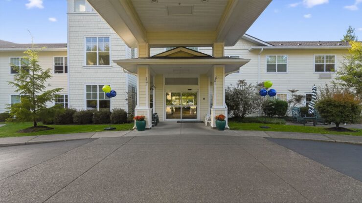 Welcoming entrance with vibrant balloons and lush greenery, fostering a sense of community and comfort.
