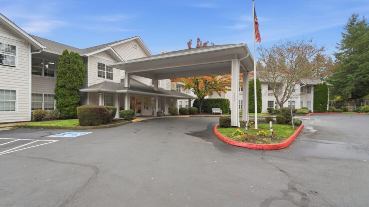 A welcoming entrance surrounded by greenery, inviting residents and visitors to a warm community atmosphere.