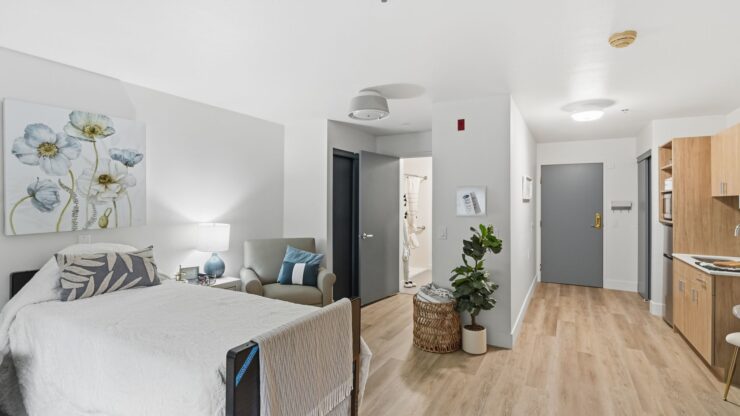 A bright, inviting room featuring comfortable furnishings, a warm atmosphere, and personal touches.