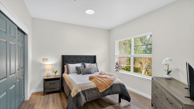 Bright and inviting, this serene bedroom offers a peaceful retreat with nature views and thoughtful decor.
