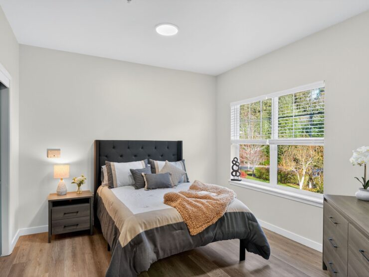 Bright and inviting, this serene bedroom offers a peaceful retreat with nature views and thoughtful decor.