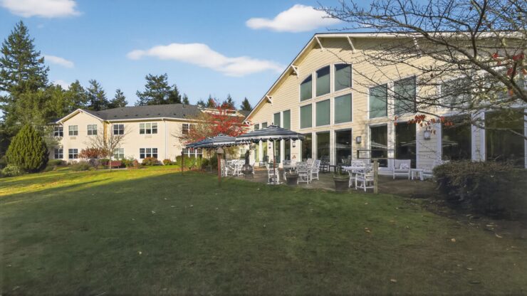 A welcoming community space surrounded by lush greenery, inviting residents to relax and connect.