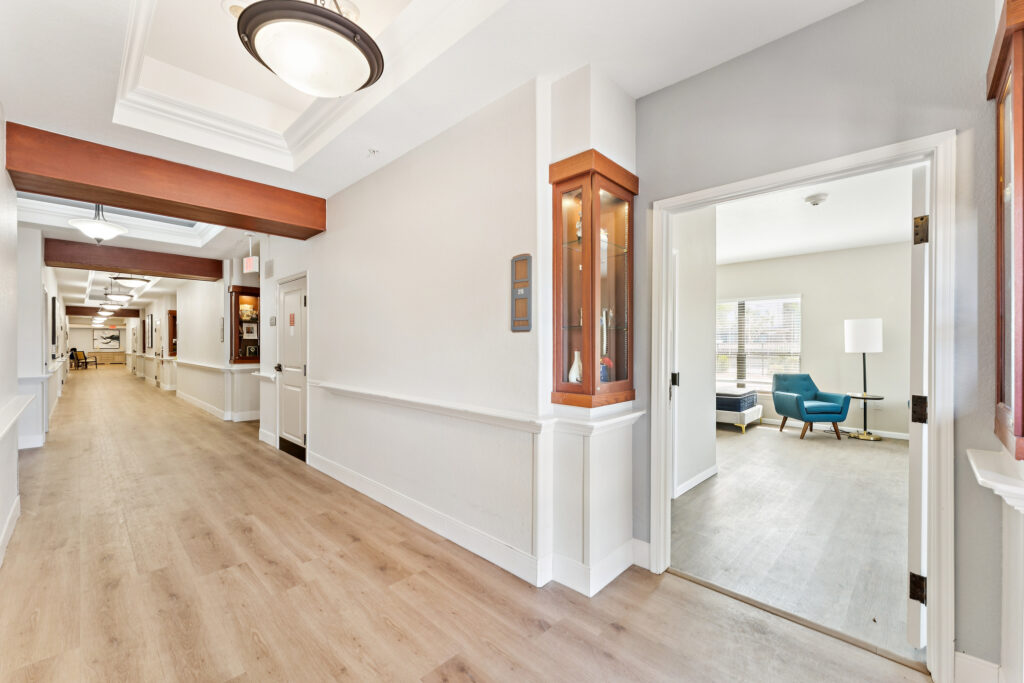 Bright and inviting hallway leads to comfortable living spaces, fostering community and warmth.