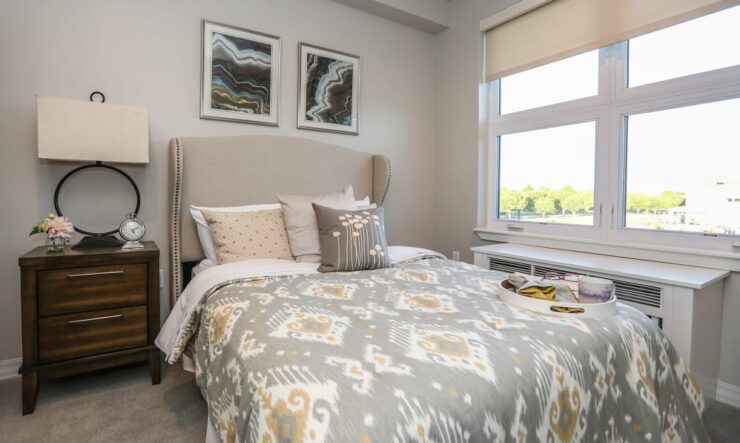 A warm, inviting bedroom filled with natural light, offering comfort and a sense of community.