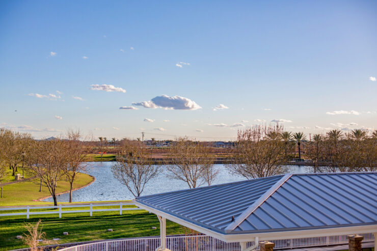 A serene lakeside view showcases a vibrant community, inviting tranquility and connection.