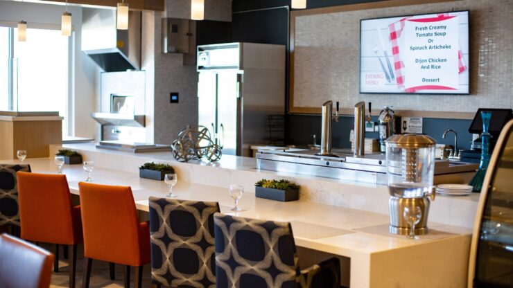 A bright, inviting dining area with stylish seating, showcasing a warm community atmosphere.