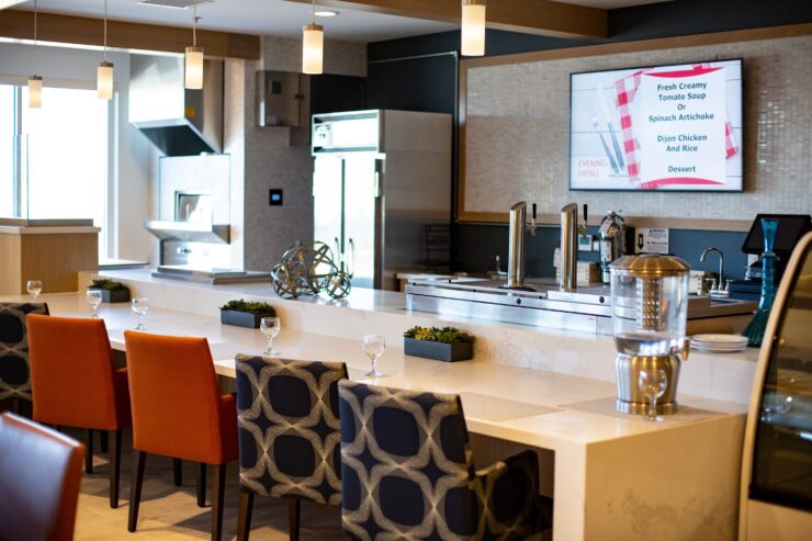 A bright, inviting dining area with stylish seating, showcasing a warm community atmosphere.