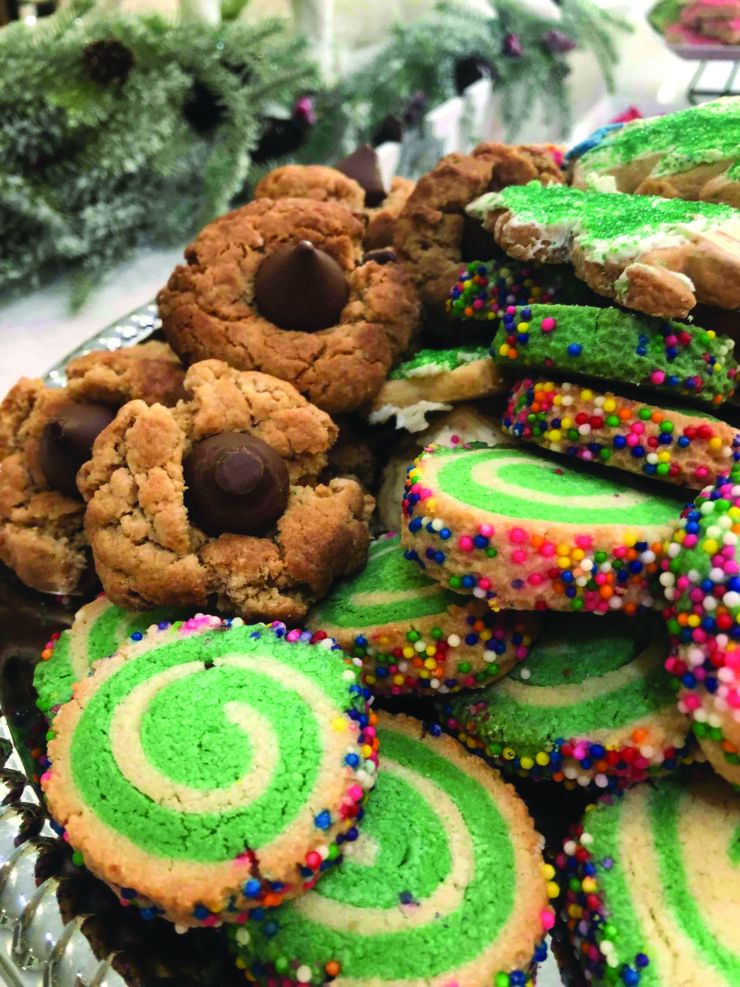 A delightful array of colorful cookies invites warmth and togetherness, perfect for community gatherings.
