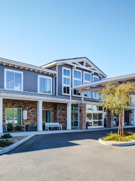 A welcoming entrance with lush landscaping invites residents and visitors into a vibrant community.