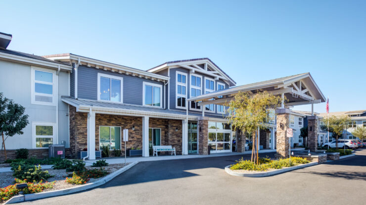 A welcoming entrance with lush landscaping invites residents and visitors into a vibrant community.
