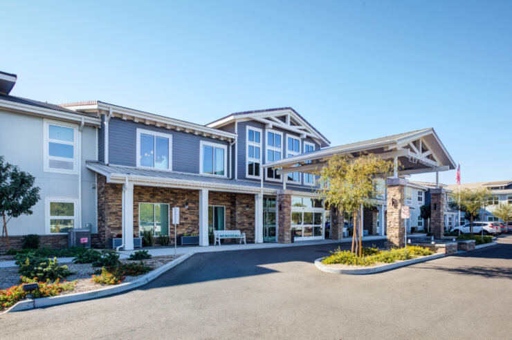 A welcoming entrance with lush landscaping invites residents and visitors into a vibrant community.