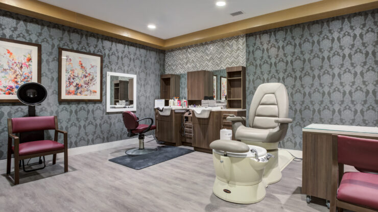 A welcoming salon space, featuring stylish furnishings and soft lighting, perfect for relaxation and community.