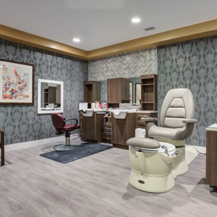A welcoming salon space, featuring stylish furnishings and soft lighting, perfect for relaxation and community.