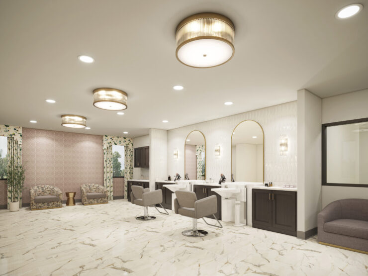 A bright, welcoming salon space featuring elegant furnishings and a serene atmosphere for relaxation.