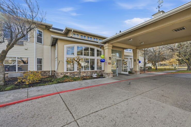 A welcoming entrance with vibrant balloons and inviting landscaping, fostering community and comfort.