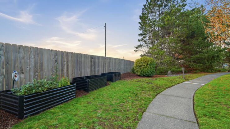 A serene garden path winds through lush greenery, inviting residents to enjoy nature's beauty and tranquility.