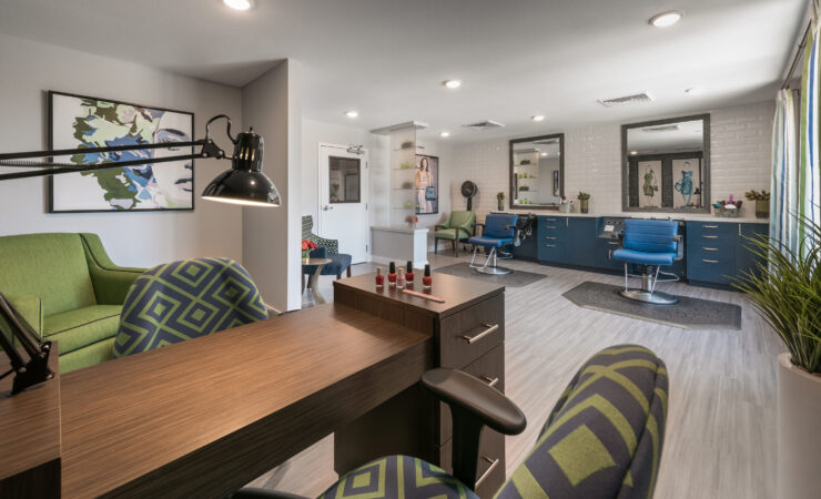 A vibrant, welcoming salon space filled with comfortable seating and modern decor, perfect for community gatherings.