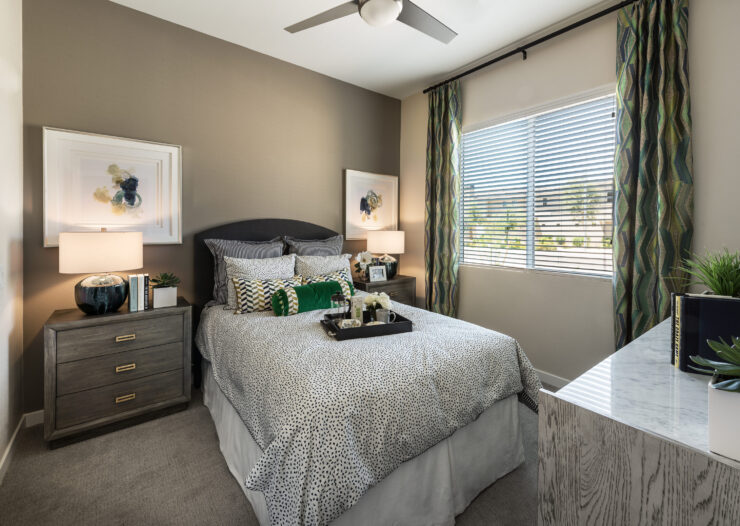 A beautifully arranged bedroom exudes warmth and serenity, ideal for relaxation and community living.
