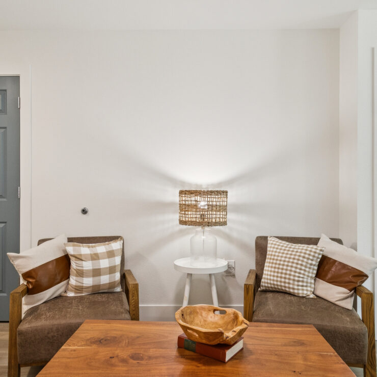 A welcoming living space featuring comfortable seating, warm lighting, and a serene atmosphere.