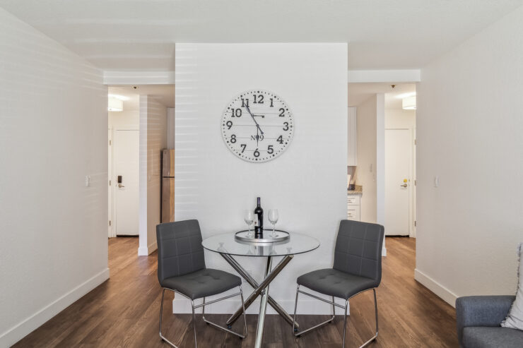 A welcoming dining area with a glass table, perfect for shared moments and connection.