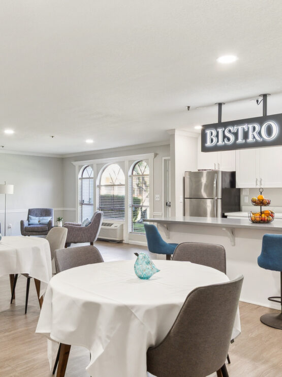 Bright and inviting bistro area, perfect for community gatherings and shared meals.