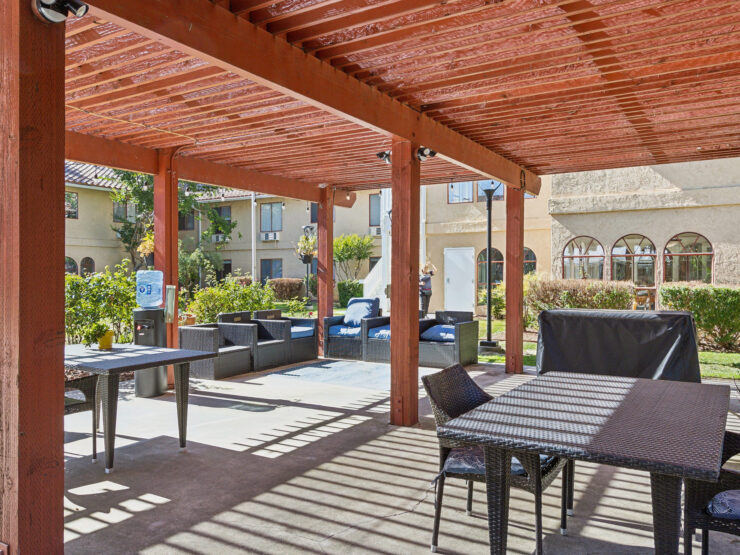 Sunny outdoor space with inviting seating, perfect for community gatherings and relaxation.