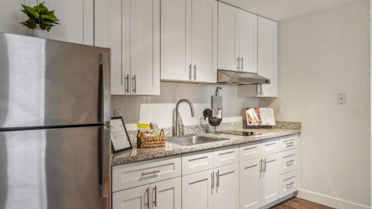 A bright, inviting kitchen with modern amenities, perfect for fostering community and comfort.