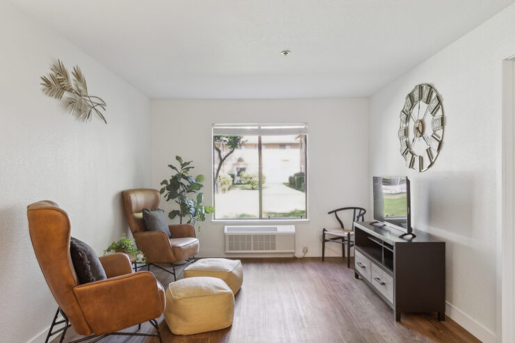 A bright, inviting lounge area with comfortable seating, fostering a warm community atmosphere.