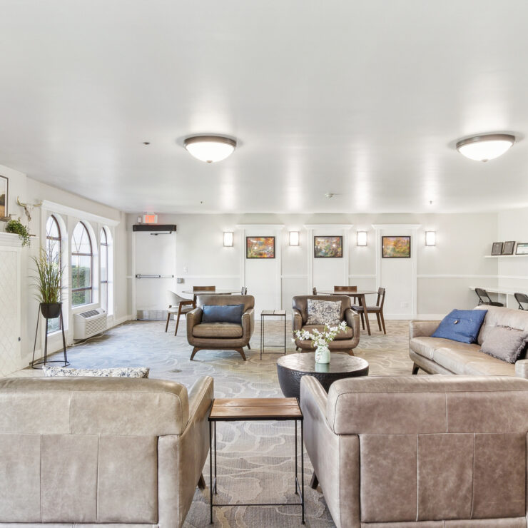 A warm gathering space featuring comfortable seating, a inviting fireplace, and a welcoming atmosphere for community connection.