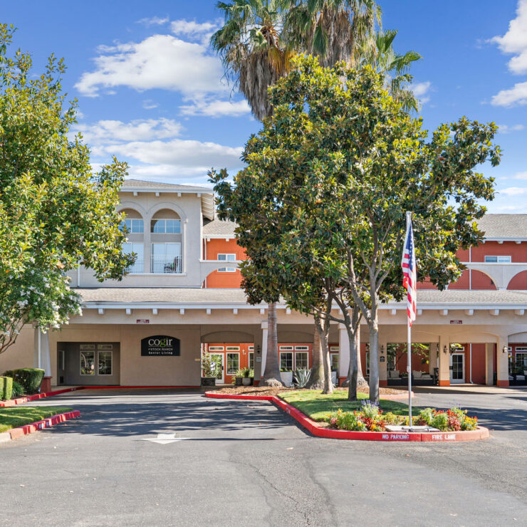 A welcoming entrance surrounded by lush greenery, inviting residents to a vibrant community.