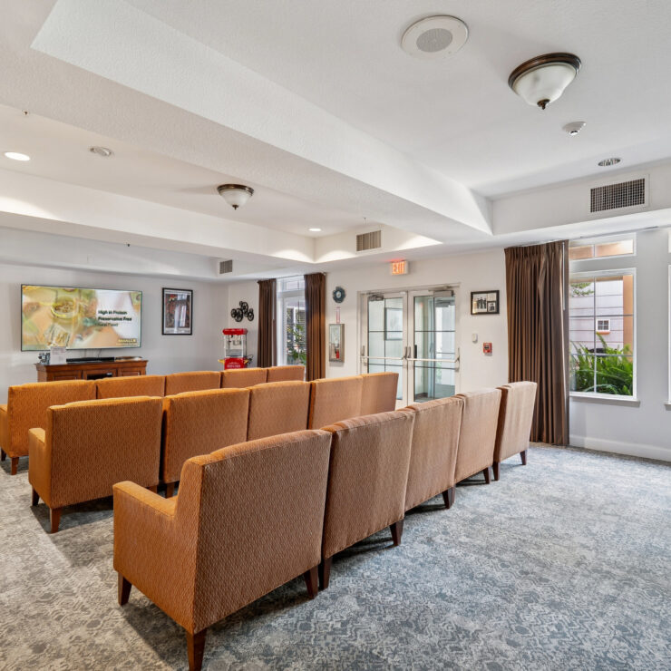 A welcoming lounge area features comfortable seating, warm lighting, and vibrant decor, perfect for community gatherings.