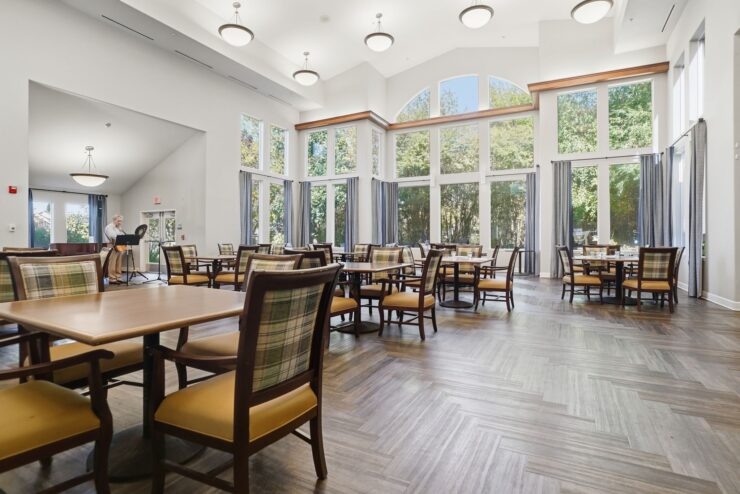 Bright, inviting dining area with spacious seating, fostering community and connection among residents.