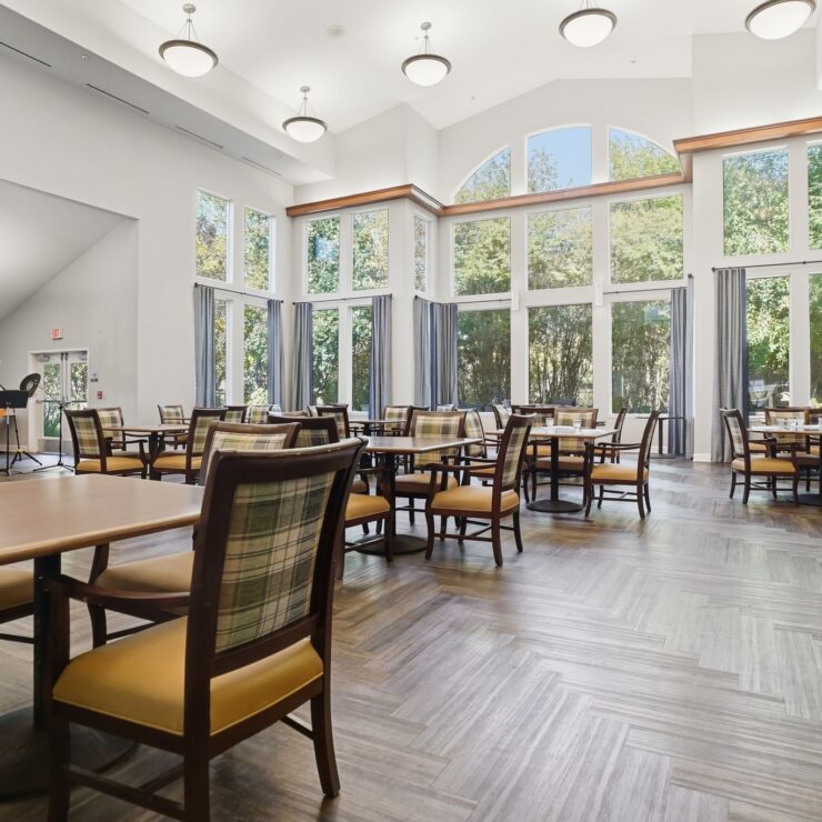 Bright and inviting space with ample seating, fostering community and comfort for residents.