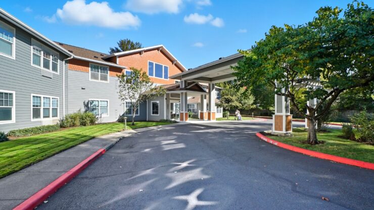 Welcoming entrance surrounded by greenery, fostering a warm community atmosphere for residents.