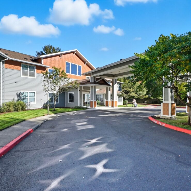 A welcoming entrance leads to a vibrant community, surrounded by greenery and a bright, sunny sky.