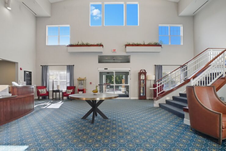 Bright and inviting lobby fosters community spirit, featuring comfortable seating and welcoming decor.