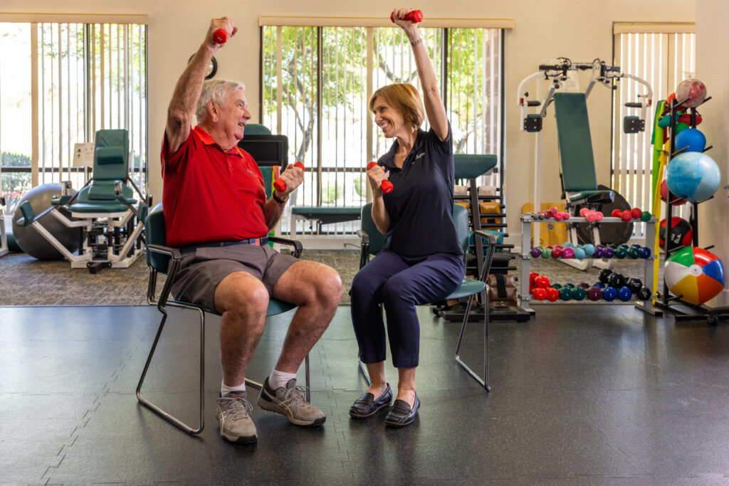 A vibrant fitness session showcases a joyful connection between residents and staff, promoting wellness and community.