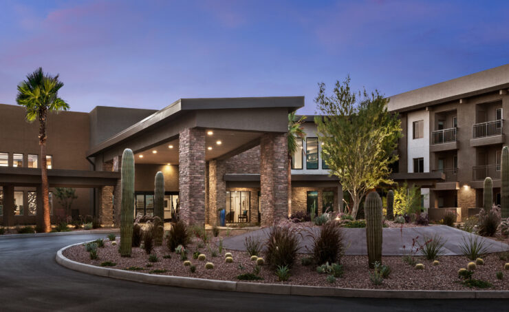 A welcoming entrance surrounded by lush landscaping, inviting a sense of community and comfort.