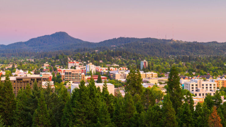 A vibrant community nestled among lush trees, showcasing a peaceful blend of nature and urban life.